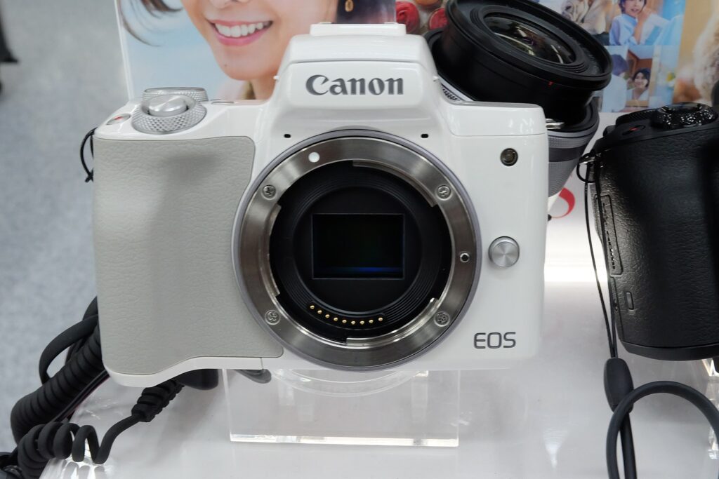 Canon EOS M50 mirrorless camera with 15-45mm lens – front angled view on white background