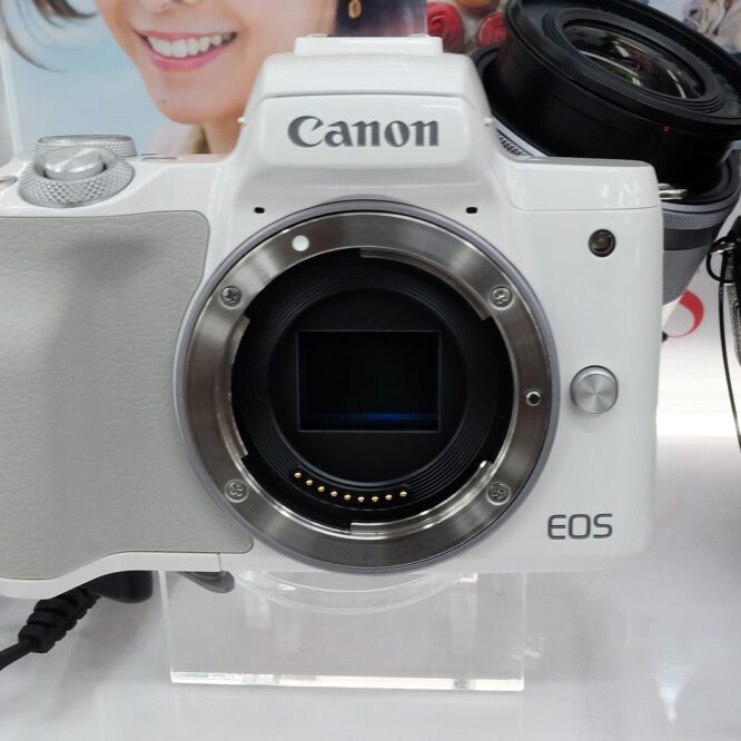 Canon EOS M50 mirrorless camera with 15-45mm lens – front angled view on white background