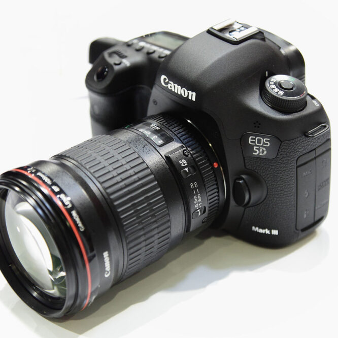 Canon EOS 5D Mark III full-frame DSLR camera body with lens, photographed on white background for professional 2025 review