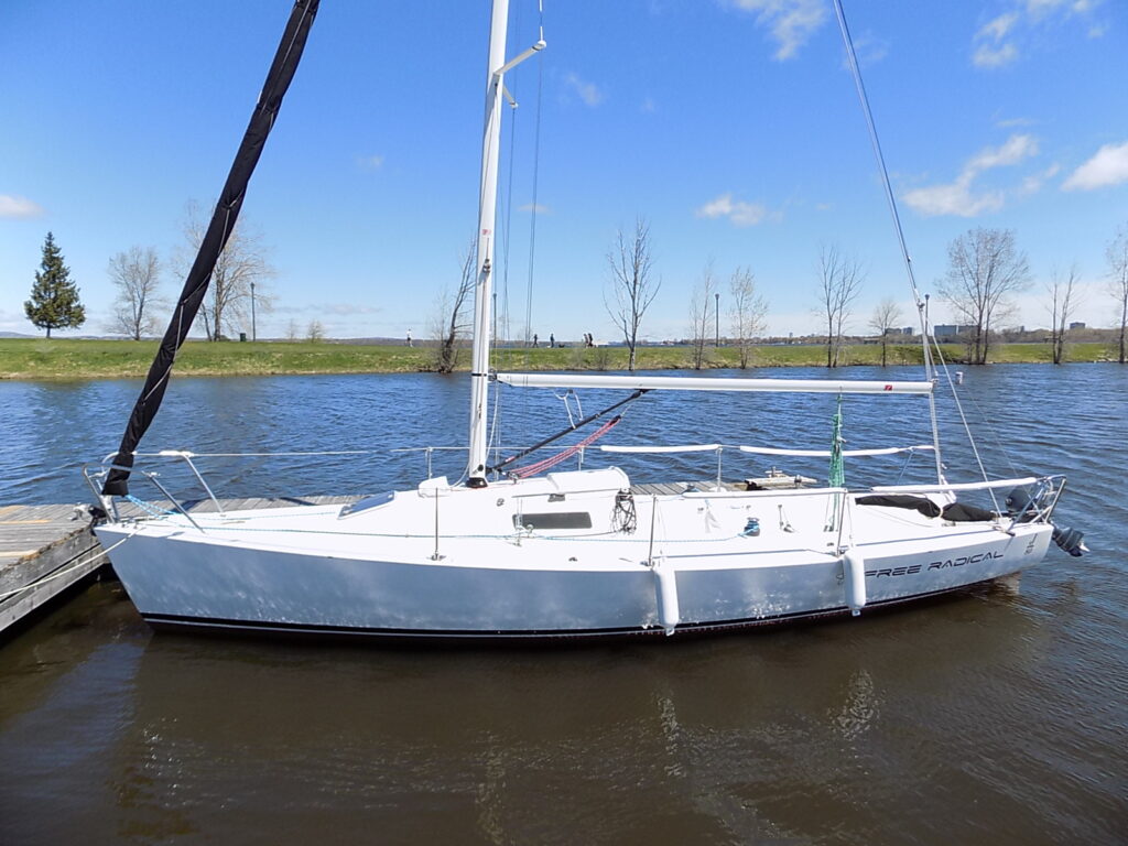 Photograph of a boat docked on a lake taken with a Nikon CoolPix L340: Review Example