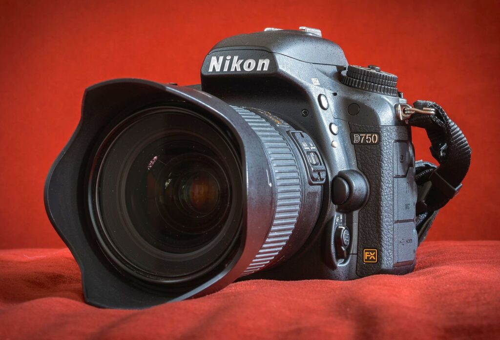 Nikon D750 with Kit Lens red background