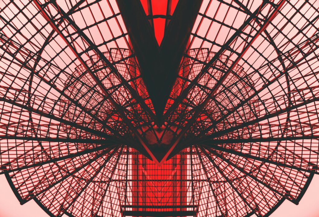 Abstract Photography - Image of a radio tower overlayed in front of other architecture. 